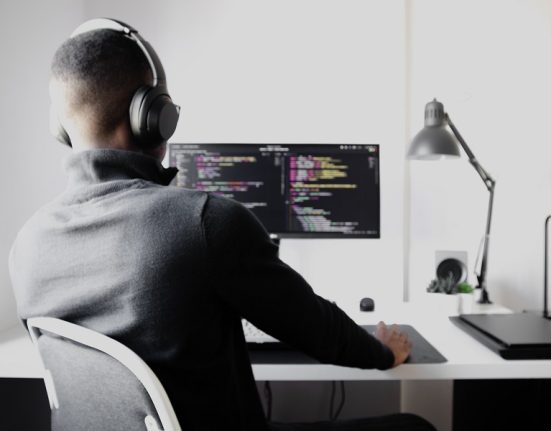 Developer Interest, shadowy super-coder in front of a computer